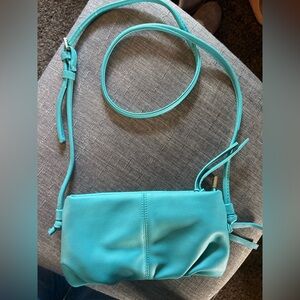 Brand new Joy Susan Turquoise Crossbody measures 10” x 5”